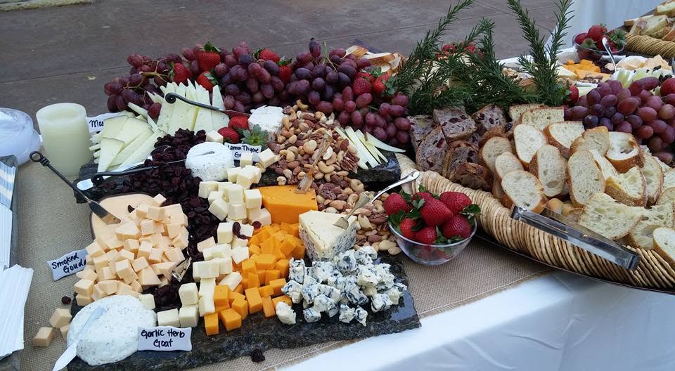 Artfully arranged charcuterie board with cured meats, cheeses, and fresh garnishes