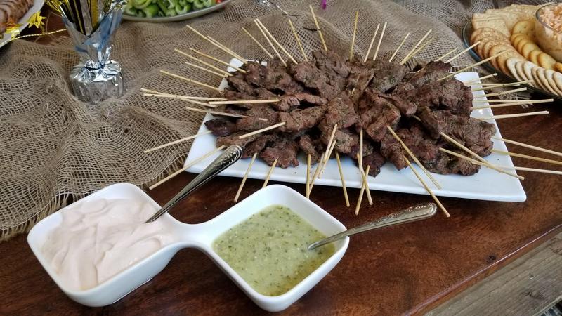 Beef skewers served with two dipping sauces