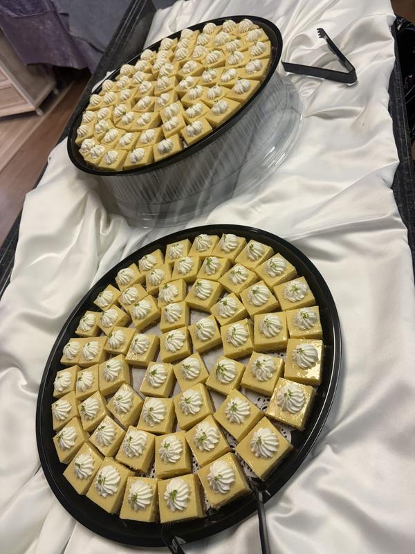 Two round trays of bite-size key lime squares