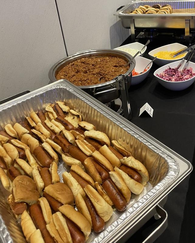 Hotdog bar buffet line with chafing dishes
