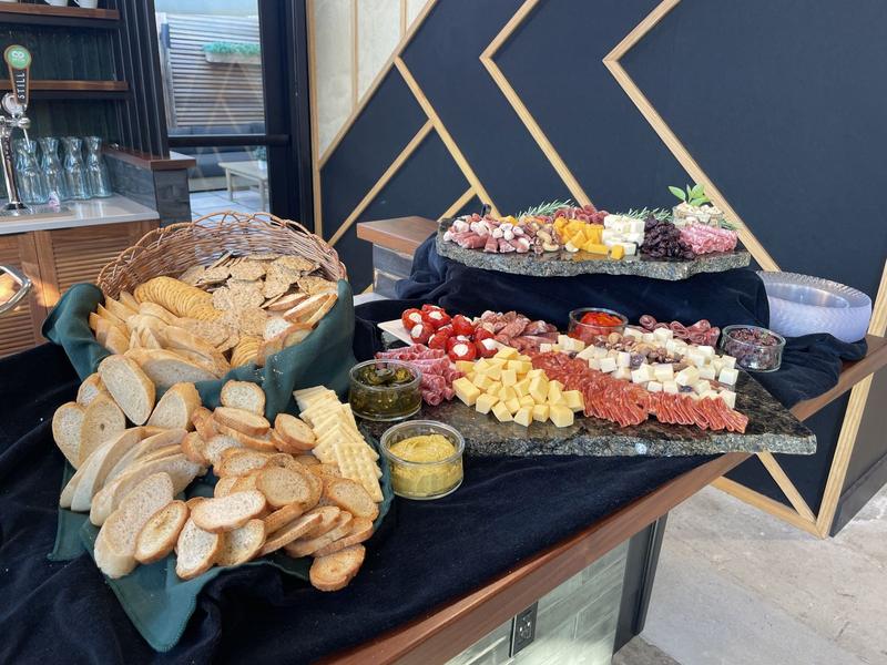 Charcuterie and bread on black linens