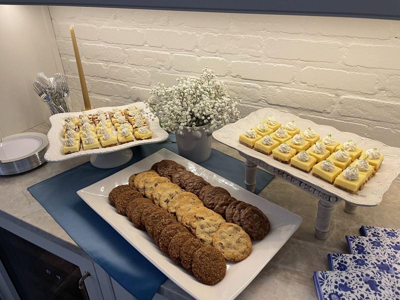 Chocolate chip cookies and trays of dessert bars