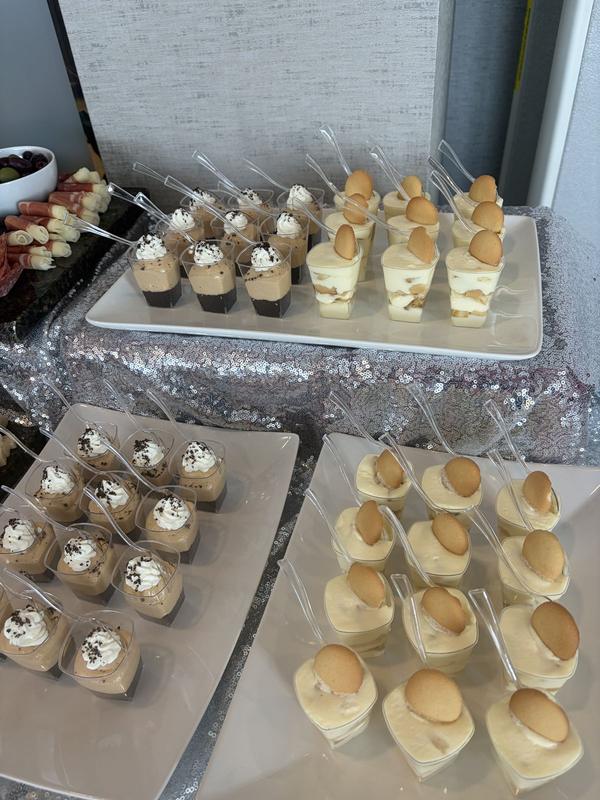 Individual dessert cups on a serving table