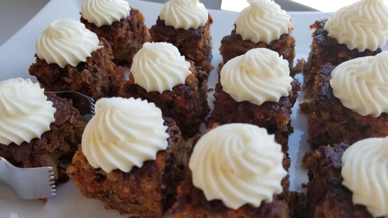 Carrot cake bites topped with swirls of white frosting