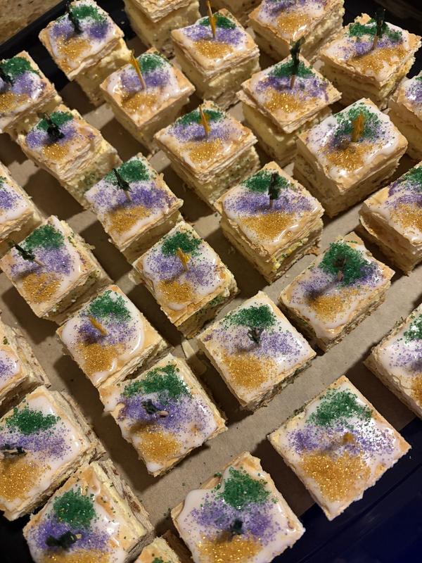 Dessert squares topped with purple, green and gold sugar