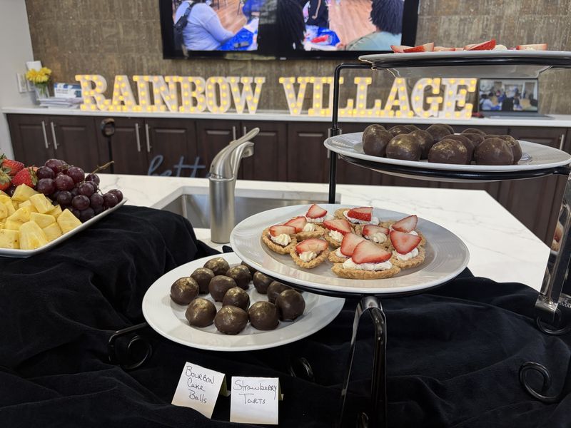 Catered buffet table with desserts and fruit