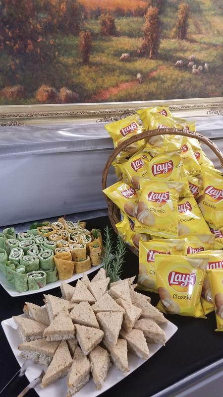 Tea sandwiches and pinwheels with individual bags of chips