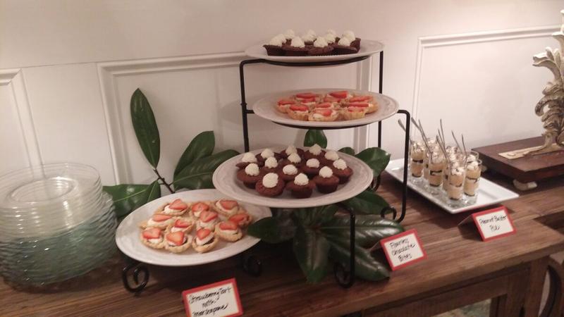 Tiered dessert stand of flourless chocolate cakes and strawberry tarts
