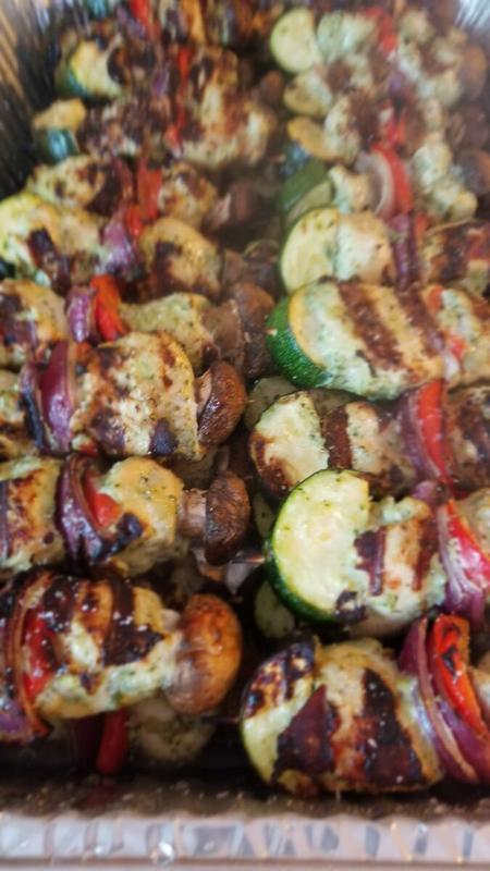 Tray of grilled vegetables and kebabs