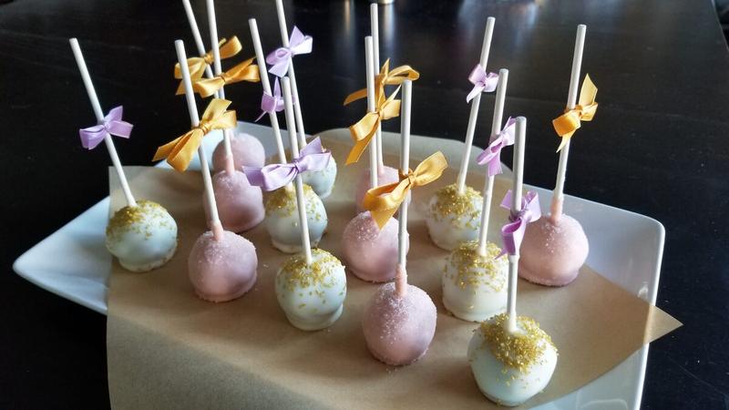 Decorated cake pops on a serving tray