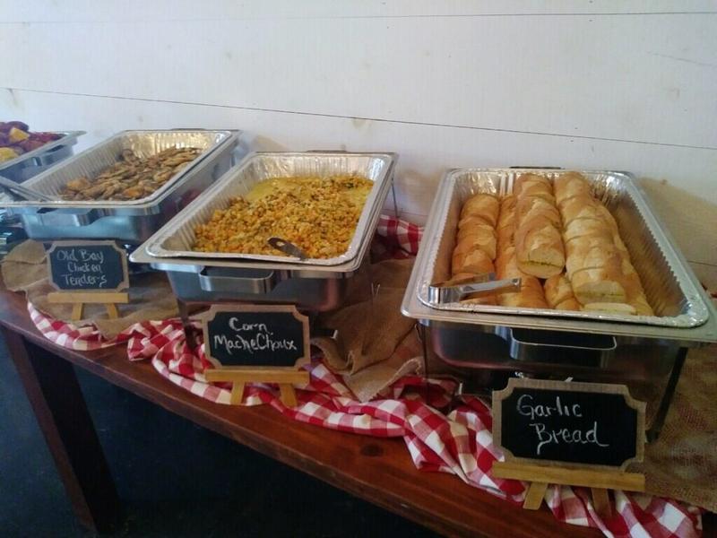 Louisiana-style buffet served in foil pans with garlic bread