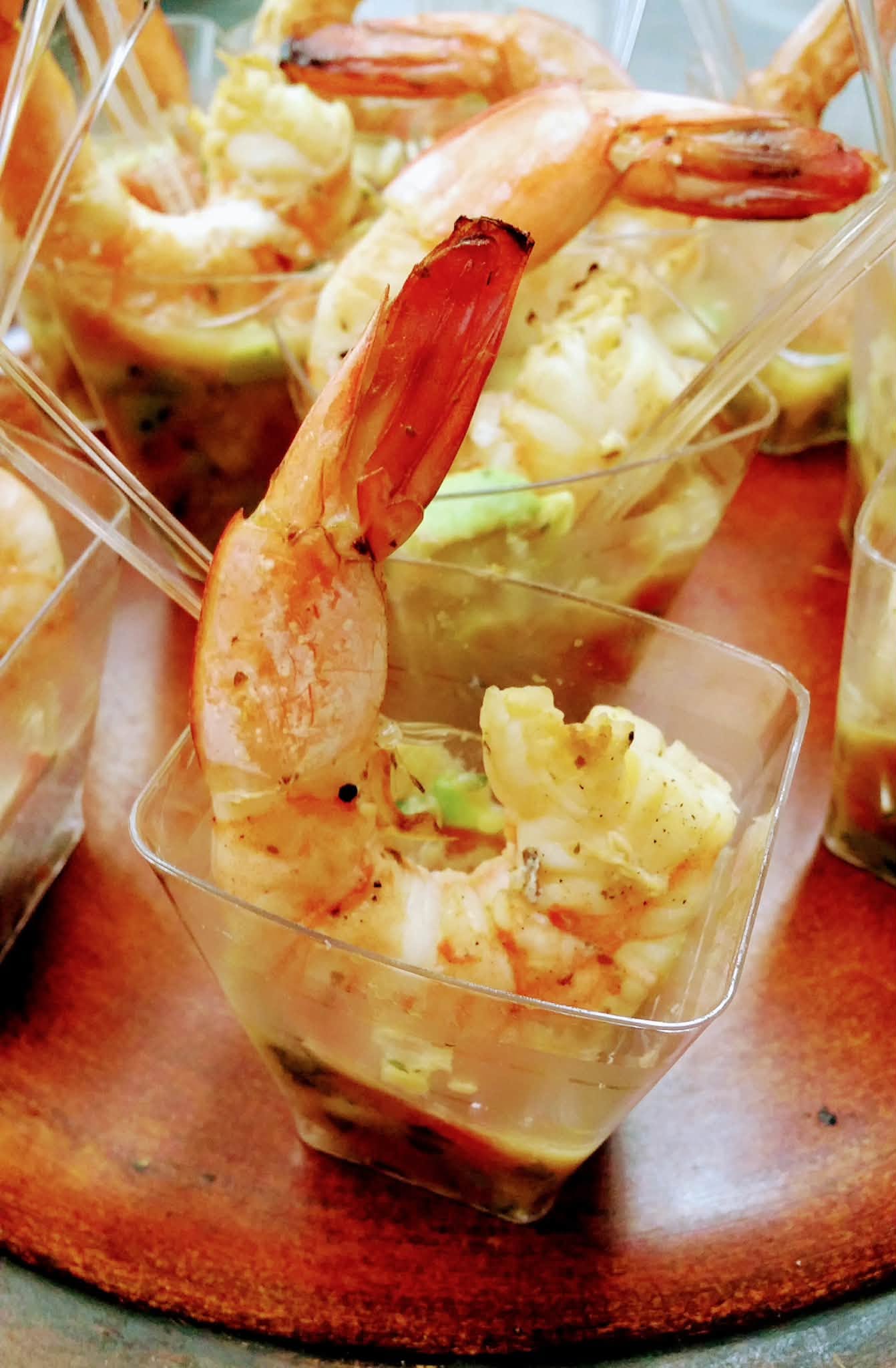 Individual shrimp appetizer cups served in clear glasses
